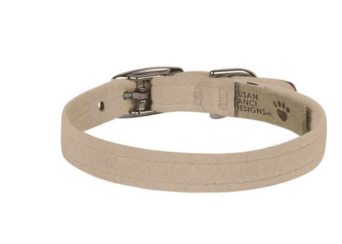 A dog collar made of beige fabric with metal buckle and hardware, designed for pet comfort and style. Perfect for everyday wear and fashionable pet accessories.